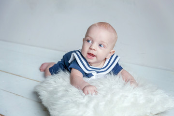 Baby sailor on the white pillow