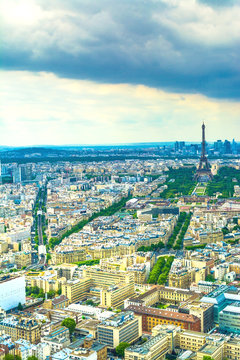 Panorama Eiffel Tower in Paris from a height on a sunny day with a blue sky. A view of Paris from a bird's-eye view.