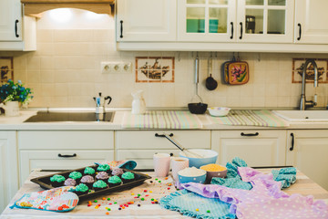 colorful cupcakes are on the tray