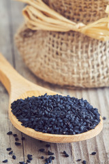 Black cumin seed (Nigella sativa) in wooden spoon