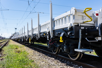 Burgas, Bulgaria - March 20, 2017 - Freight cargo train - 4axled flat wagon white Type:Rens...