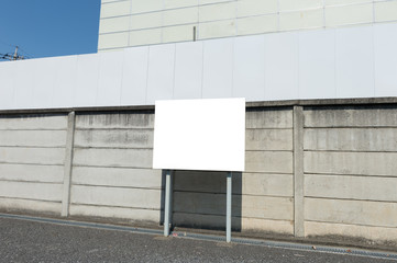 Fototapeta na wymiar Large blank billboard on a street wall, banners with room to add your own text