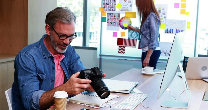 Male graphic designer working at desk