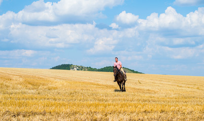Man ride horse on field