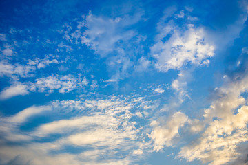 Naklejka na ściany i meble Beautiful a group of clouds in the blue sky during the sun shin background.