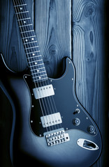 vintage electric guitar on blue