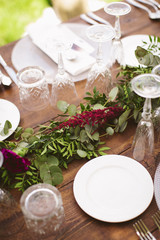 Obraz na płótnie Canvas Luxury table for a wedding decorated with flowers