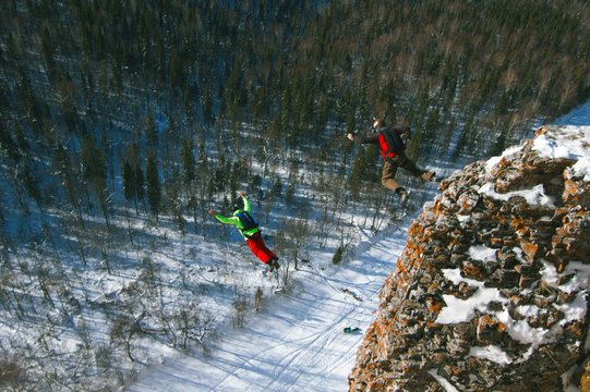 BASE jumping from a cliff in the Ural Mountains.