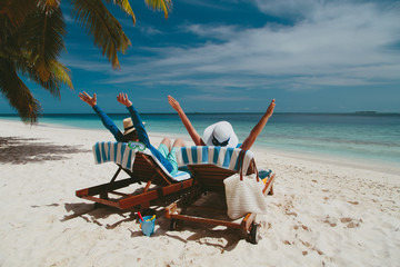 happy couple relax on a tropical beach