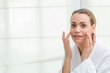 Fototapeta premium woman taking care of her skin
