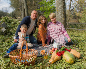 Happy family with children on a picnic.