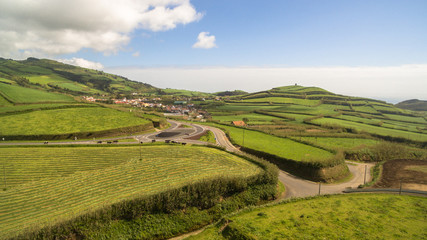 Fototapeta na wymiar Aerial view of rural landscape of Sao Miguel island with cows Azores, Portugal