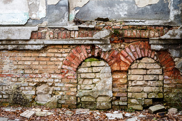 Old abandoned wall with bricked up windows