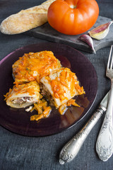 Stuffed cabbage leaves with minced meat and rice in tomato sauce.