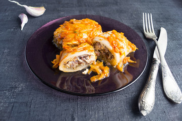 Stuffed cabbage leaves with minced meat and rice in tomato sauce.