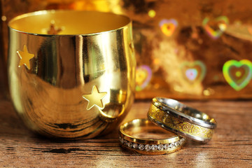 Two gold wedding rings with reflections, brilliant luxury