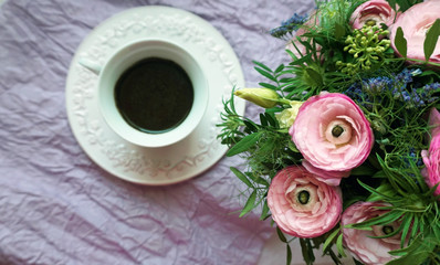 Vintage cup of coffee and a flowers