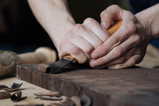 Wood Carving, The Master's Hands Work With A Wooden Surface, A Professional Does Wood Crafts