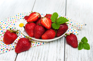 ripe strawberries on wooden table