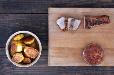 Roasted pork tenderloin with mango chutney and potatoes
