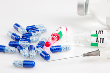 Blue capsules and pills background