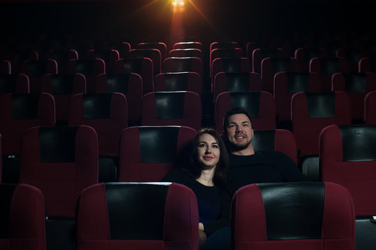 Happy Romantic Couple Watching Movie In Theater.