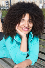 beautiful young woman smiling with curly hair