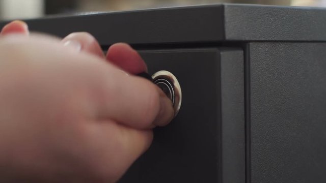 Man checks, opens and closes office cabinet.