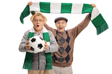 Excited elderly football fans cheering