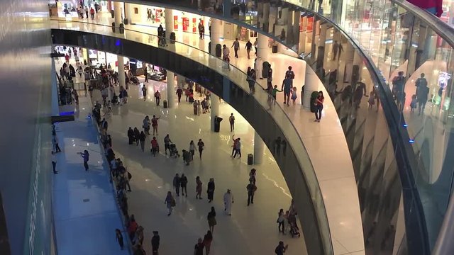 Arabian mall modern interior HD video. Many shopping people walking at stores hall. View of floors with consumers crowd