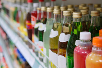 Kaluga, Russia - April, 21, 2017: Interior of a supermarket in Kaluga, Russia, with bottles on a shelf on the frontground