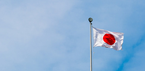 japan flag with blue sky background.