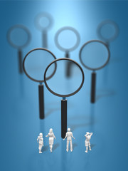 Family figures that look at plenty of magnifying glasses