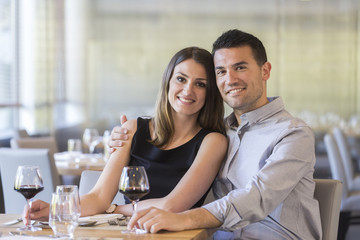 happy young couple in a restaurant