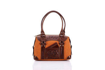 Leather ladies bag on a white background. Beautiful, fashionable, accessory, isolated. Interesting design, the texture of the skin. Comfortable handle.