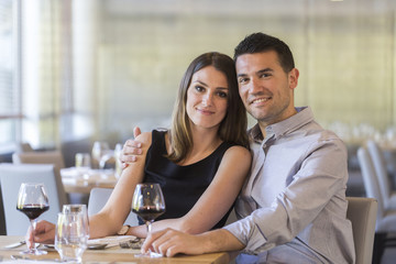 happy young couple in a restaurant