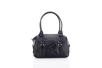 Leather ladies bag on a white background. Beautiful, fashionable, accessory, isolated. Interesting design, the texture of the skin. Comfortable handle.