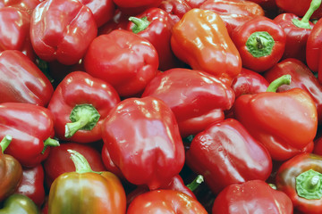 Fresh red peppers. A large number of red peppers in a pile.