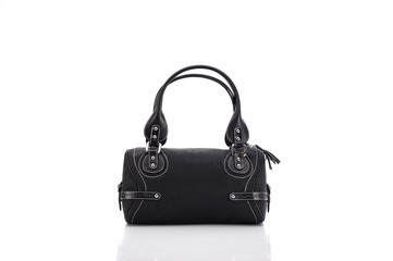 Leather ladies bag on a white background. Beautiful, fashionable, accessory, isolated. Interesting design, the texture of the skin. Comfortable handle.