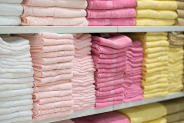 Towels in shelf store.Big shelf with a colorful stack towels