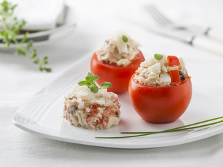 Tomatoes stuffed with a mixture of cod and vegetables.