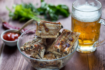 Roasted sliced barbecue pork ribs, focus on sliced meat