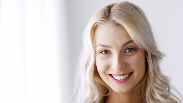 face of smiling beautiful young woman