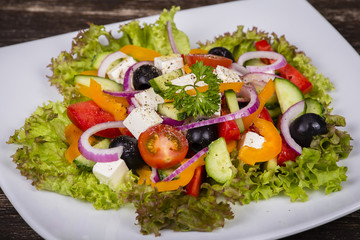 Fresh vegetable greek salad on the table