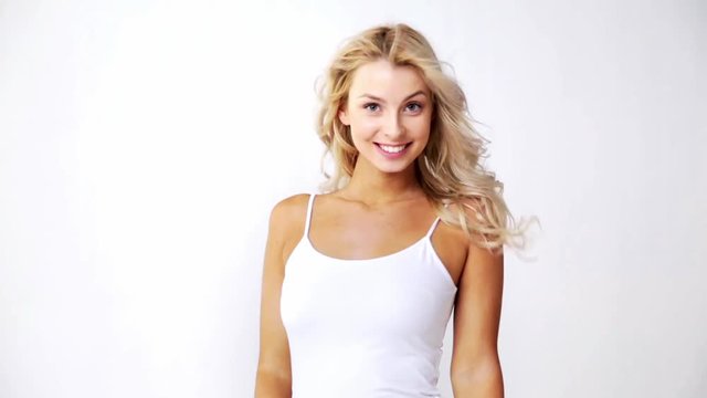 happy smiling beautiful young woman in white top