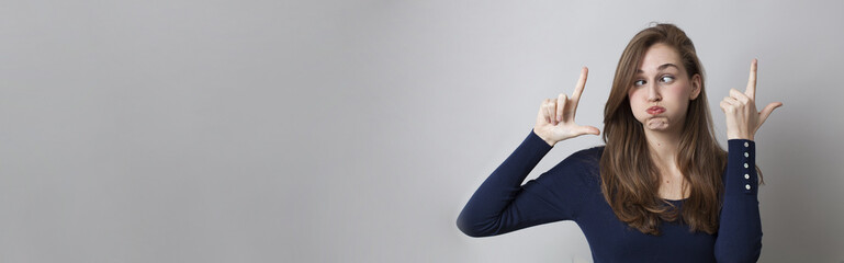 cheeky girl enjoying an exaggerated LOL with a funny face