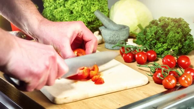 Chopping bell pepper for healthy dinner preparation. Cooking background
