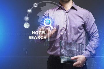 Business, Technology, Internet and network concept. Young businessman working on a virtual screen of the future and sees the inscription: Hotel search