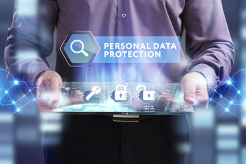 Business, Technology, Internet and network concept. Young businessman working on a virtual screen of the future and sees the inscription: Personal data protection