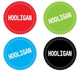HOOLIGAN text, on round wavy border stamp badge.